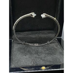 signed GIVENCHY  hinged cuff bracelet Crystal accents that roll Silver color